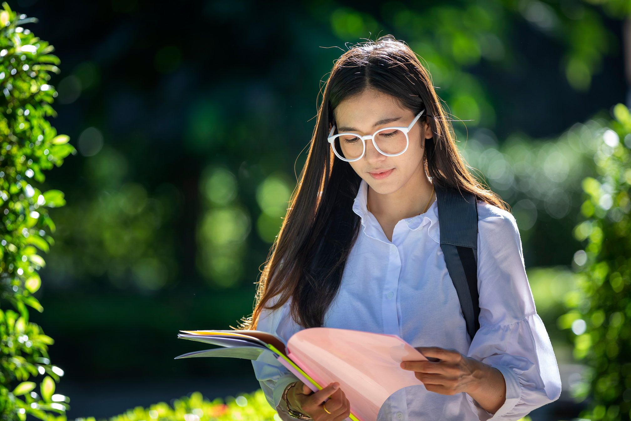 Female Student Wearing Glasses Outdoors